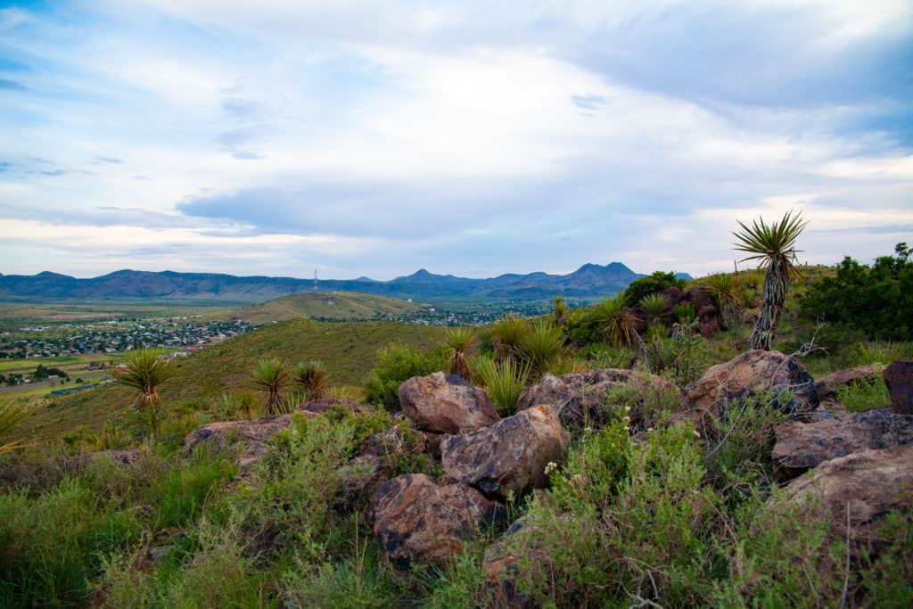 a landscape with a city and mountains