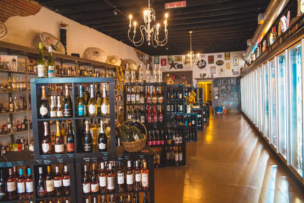 shelves filled with various bottles of wine and liquor