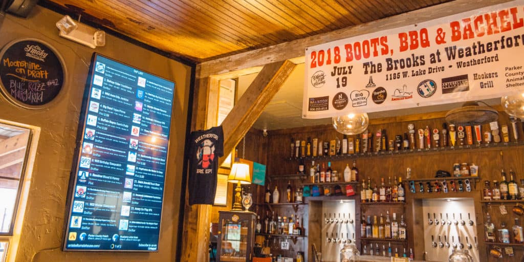 Bar features sign for 'Old Boots BBQ and Recycling