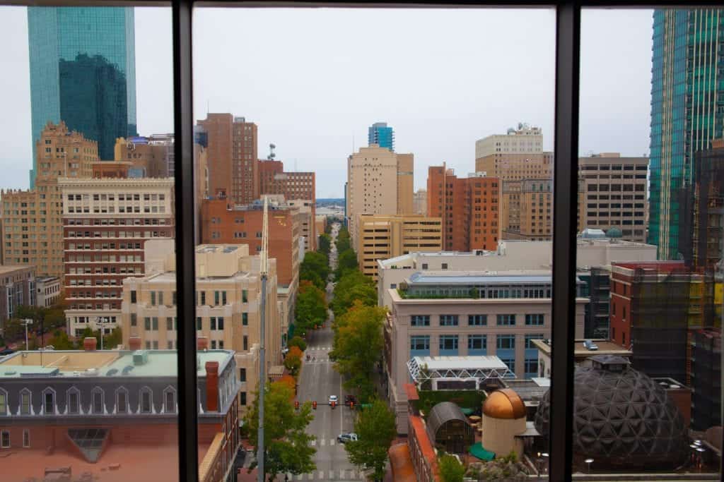 A panoramic view of the city skyline from the top of a high-rise building