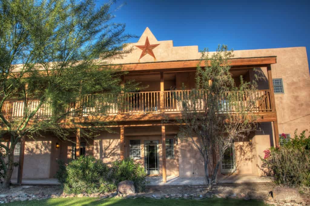 Two-story adobe-style house