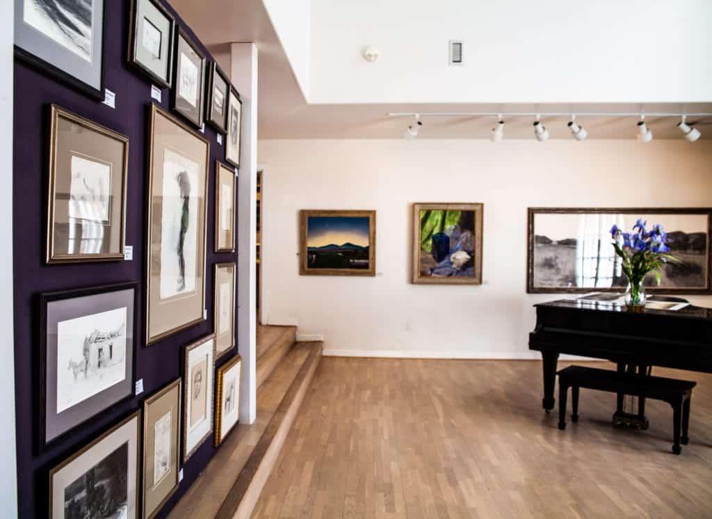 Art gallery interior with framed artworks on walls