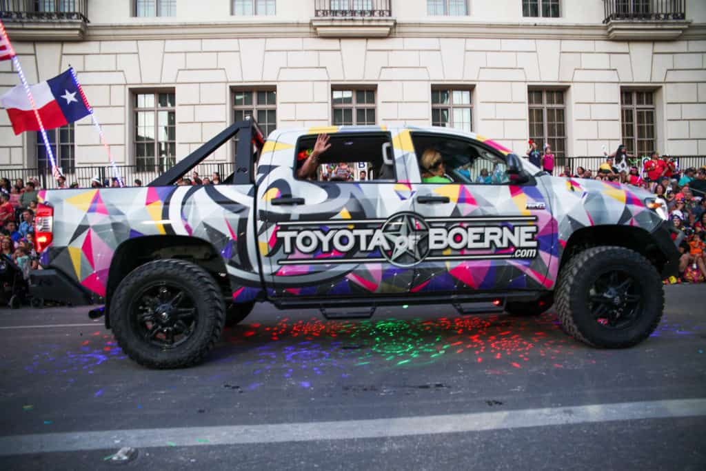 A colorful wrapped pickup truck