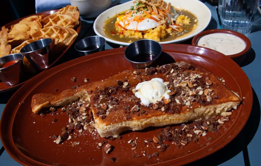 a plate with a bread and a side of food