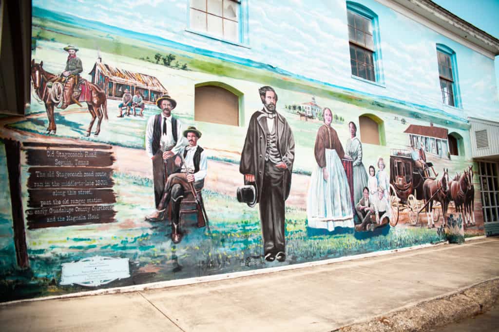 a mural of people on a building