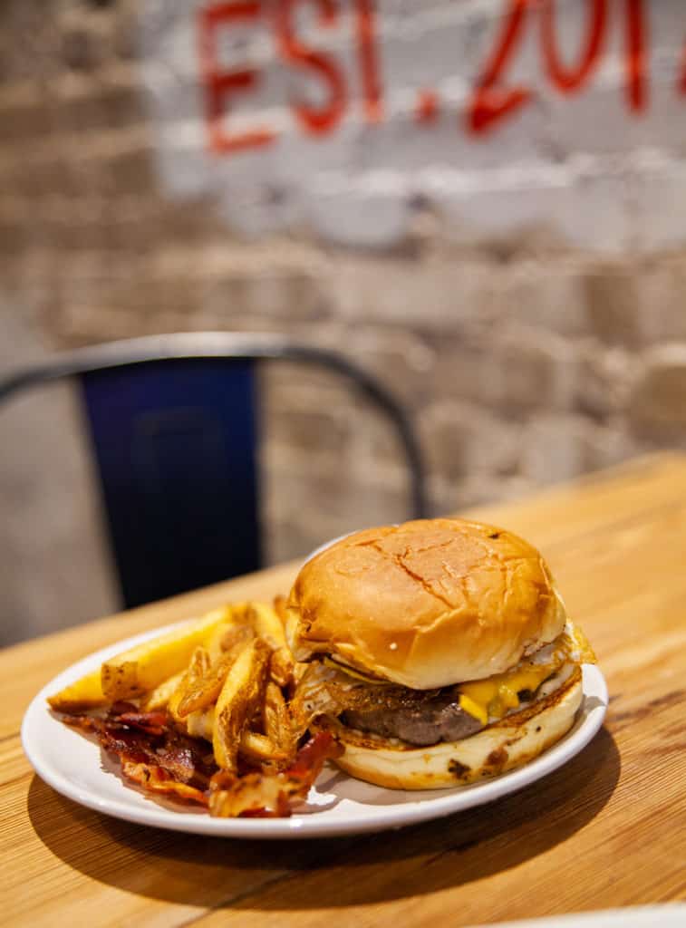 a burger and fries on a plate