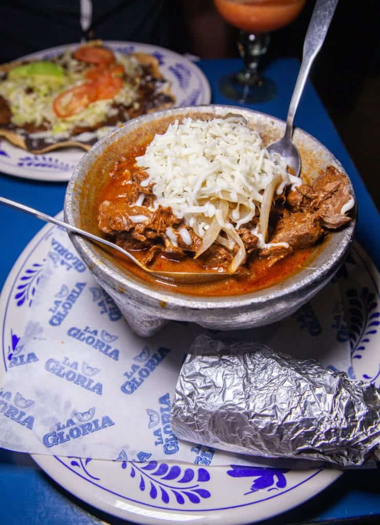 a bowl of food with a spoon