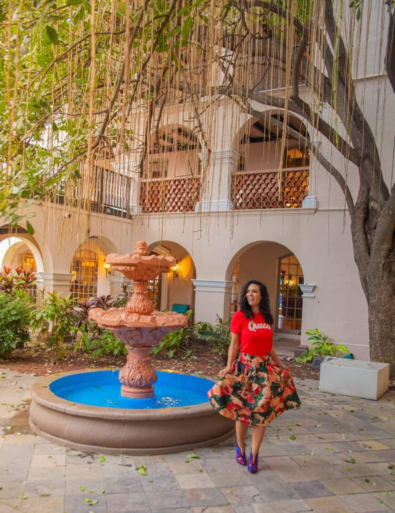 me standing next to a fountain