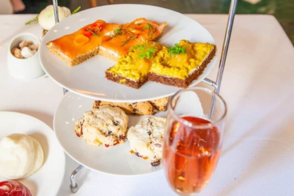 Array of pastries with a glass of champagne next to them