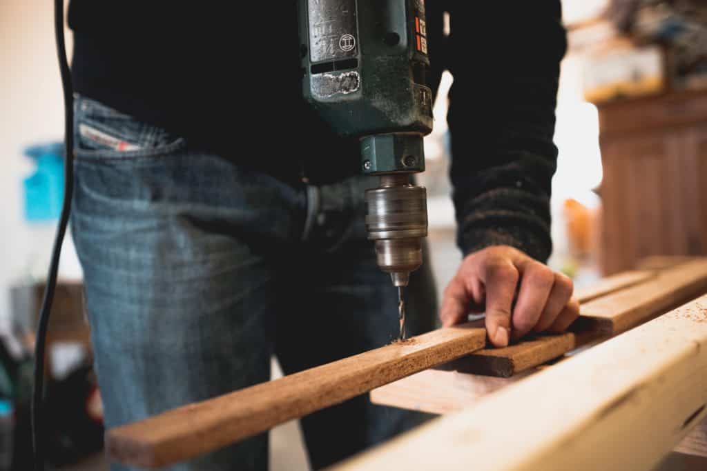 Close-up of a person's hands drilling