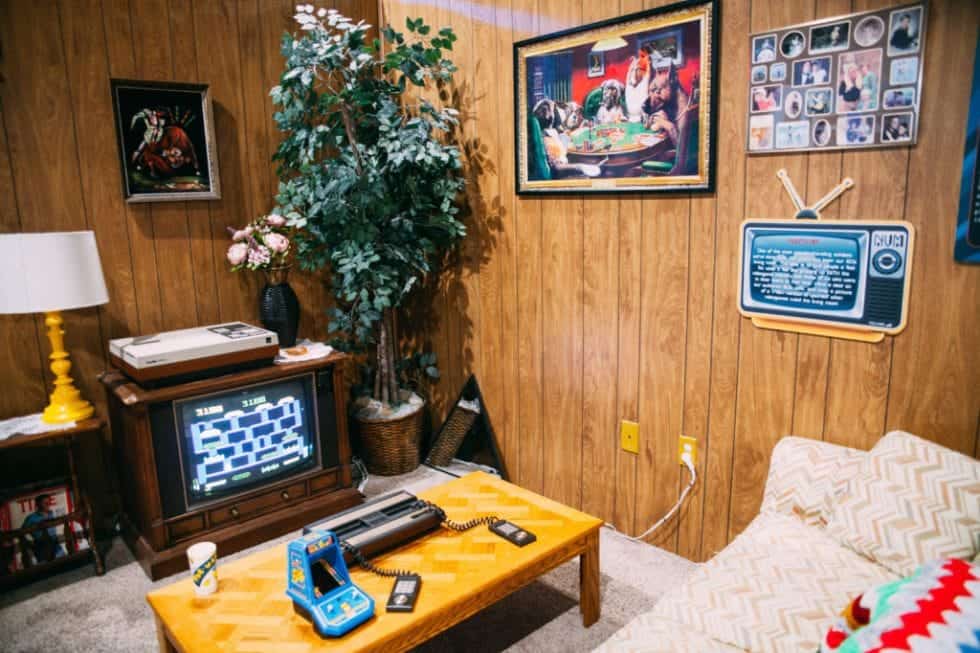 A retro living room with wood paneling