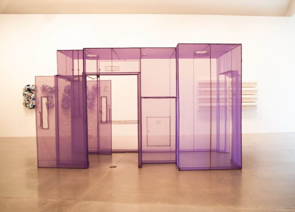 a purple transparent structure in a room