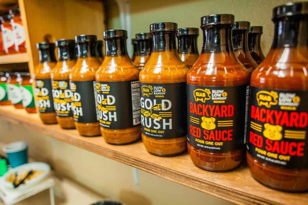 a row of bottles of sauce