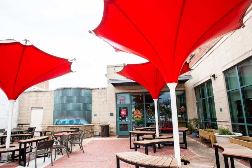 a red umbrellas on a patio