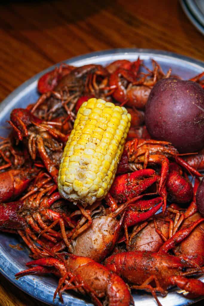 a bowl of crawfish and corn