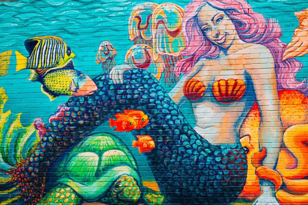 a mural of a mermaid and fish