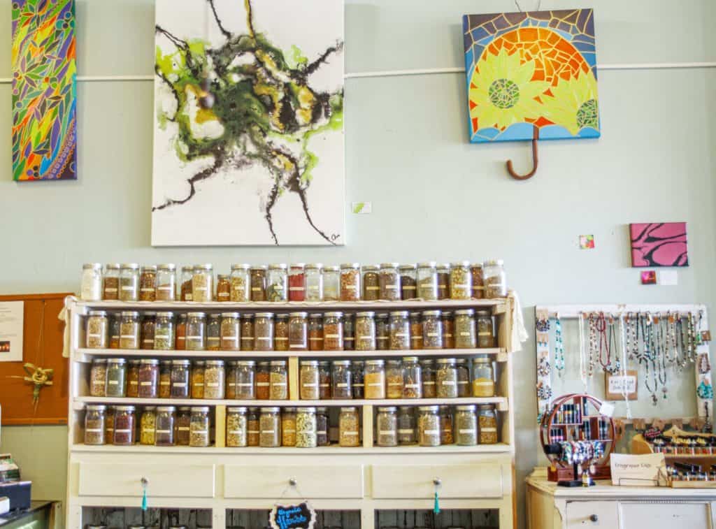 a shelf with jars of spices