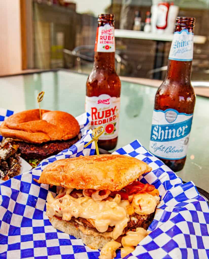 a burger and beer on a table