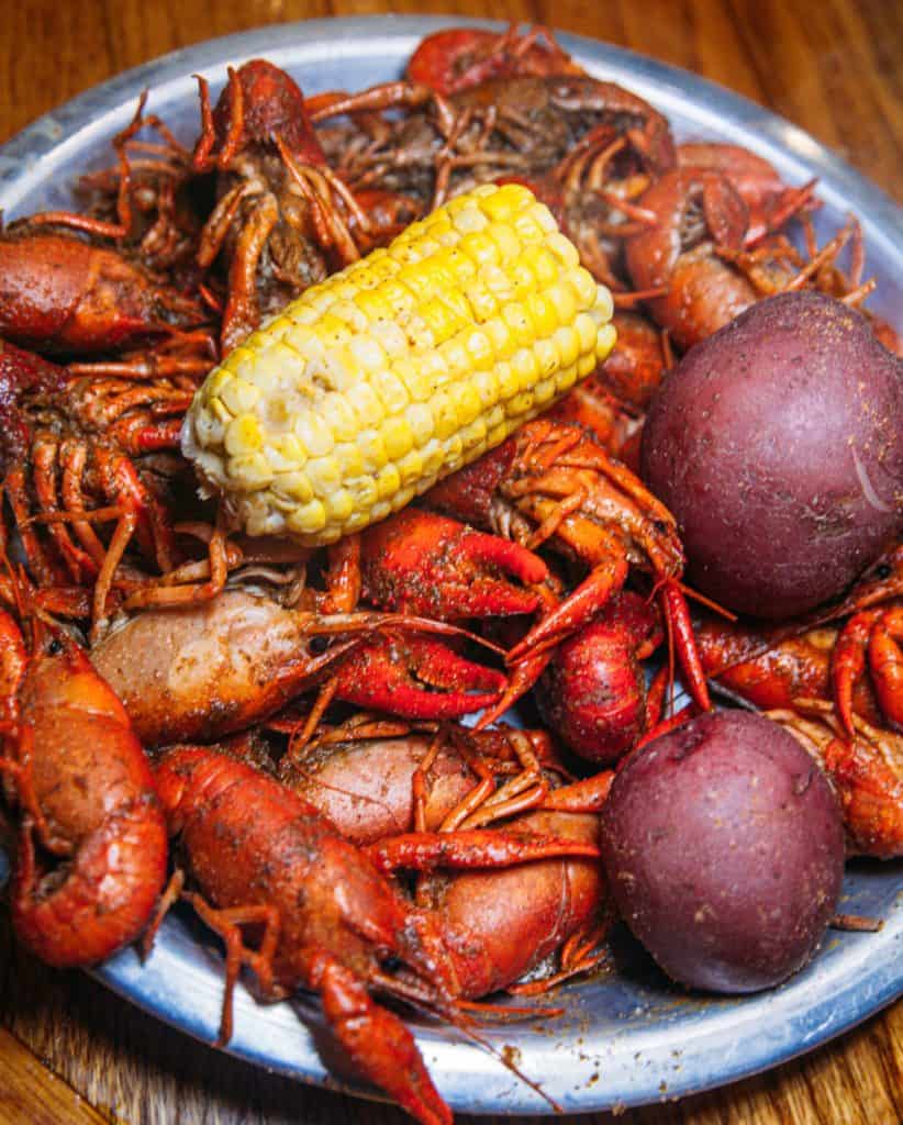 a bowl of crawfish and corn