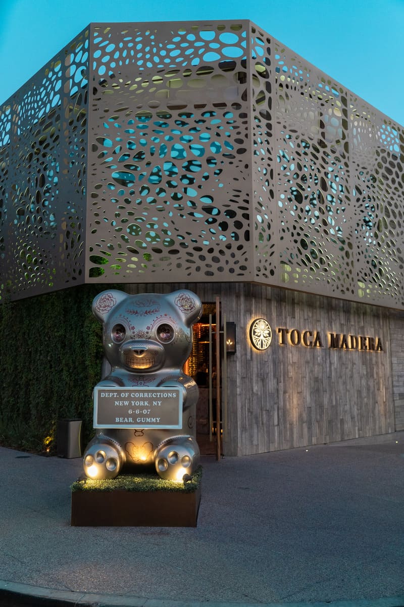 Exterior of the restaurant with a silver teddy bear statue out front