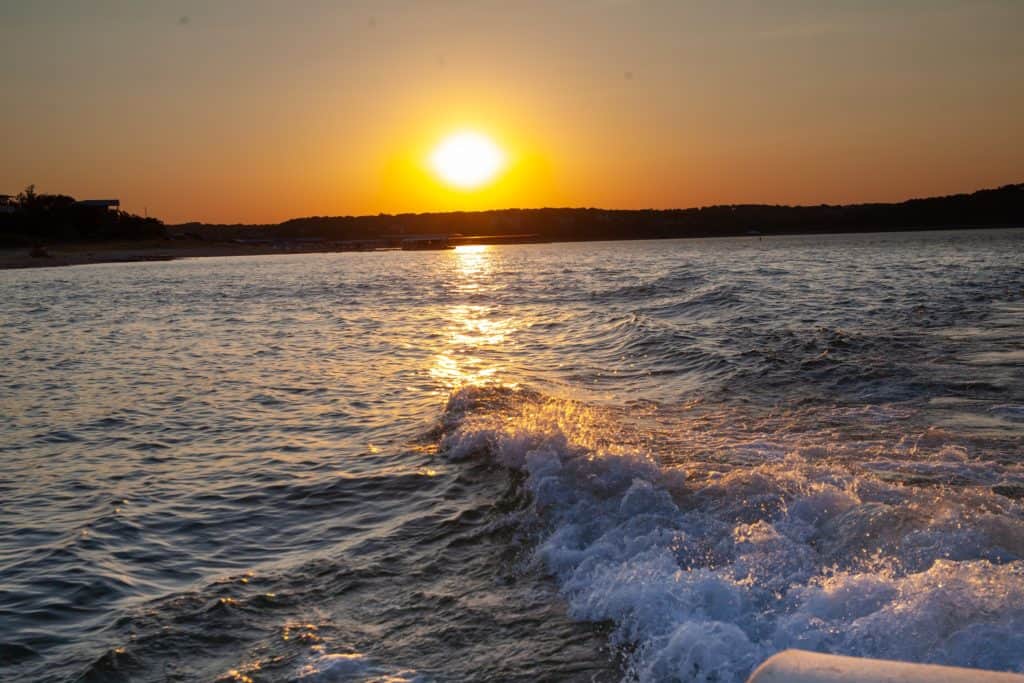 a sunset over a body of water