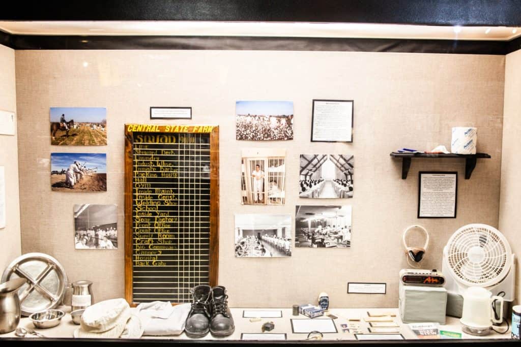 a display case with a board and pictures