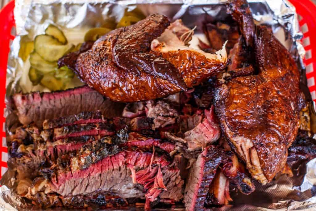 a tray of meat and vegetables