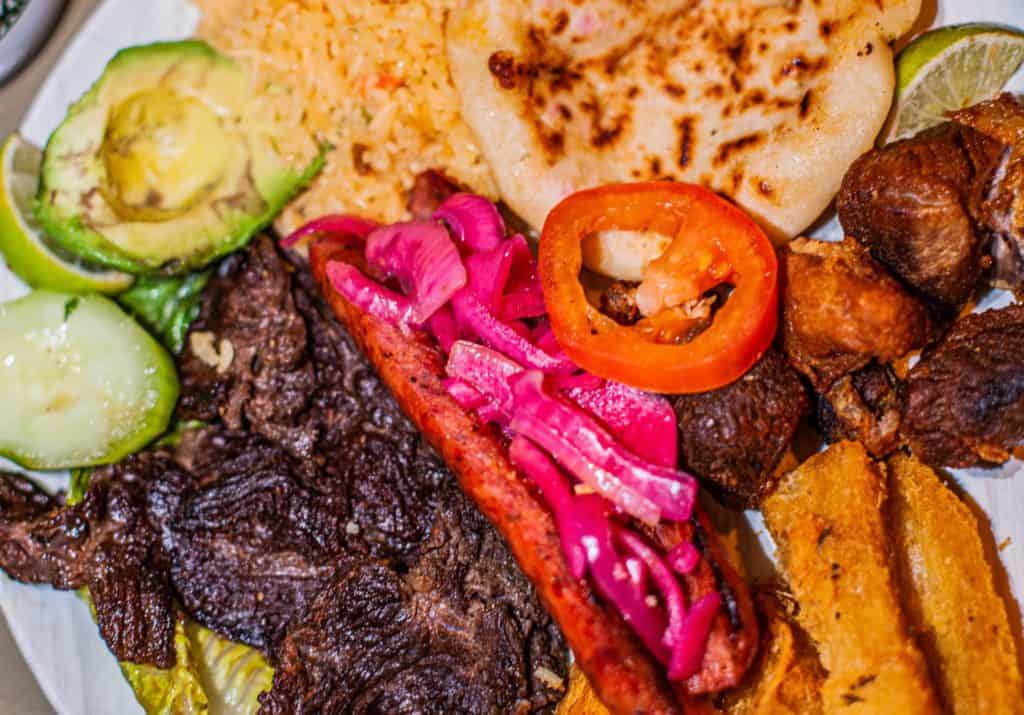 a plate of food with meat and vegetables