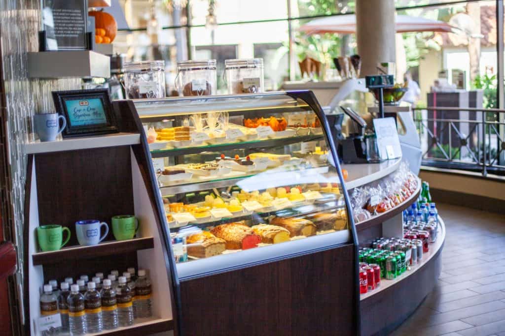A bakery interior featuring a display case filled with various baked goods