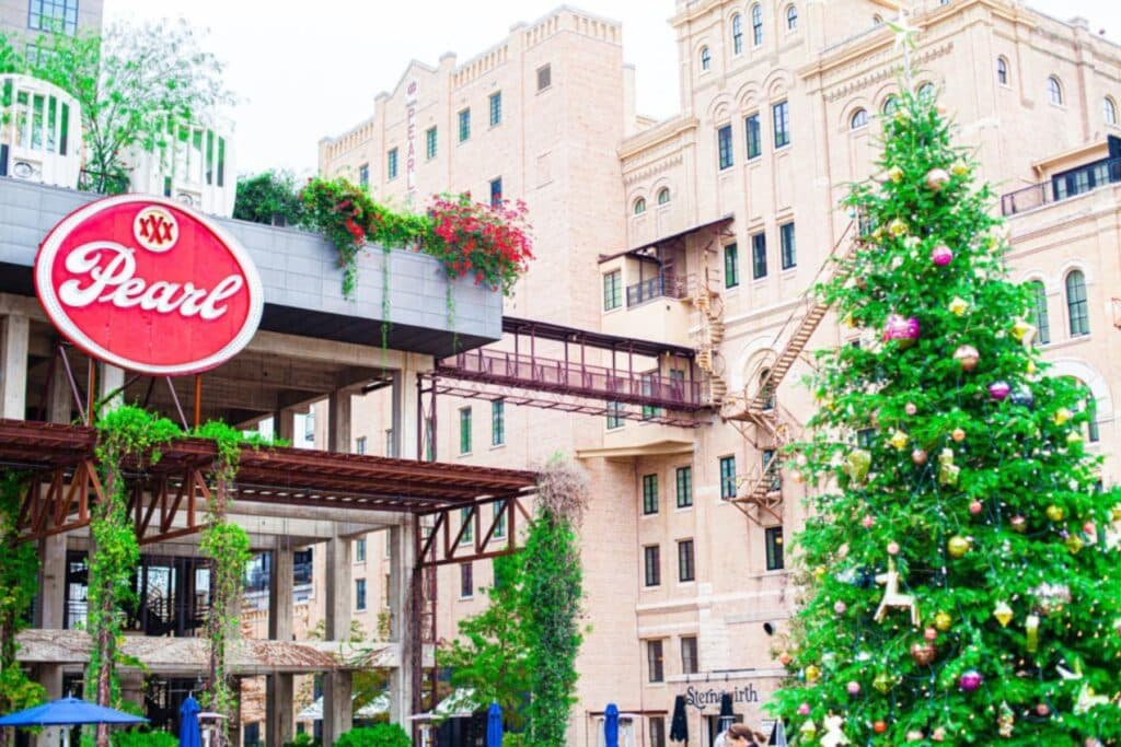 Outside of the Pearl Brewery with a Christmas tree next to it