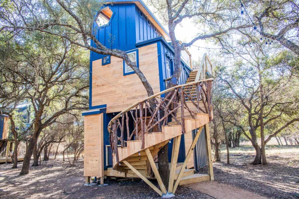 a spiral staircase in a tree house