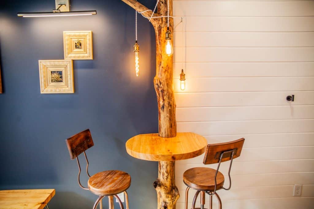 a table and chairs in a room in HoneyTree Farm