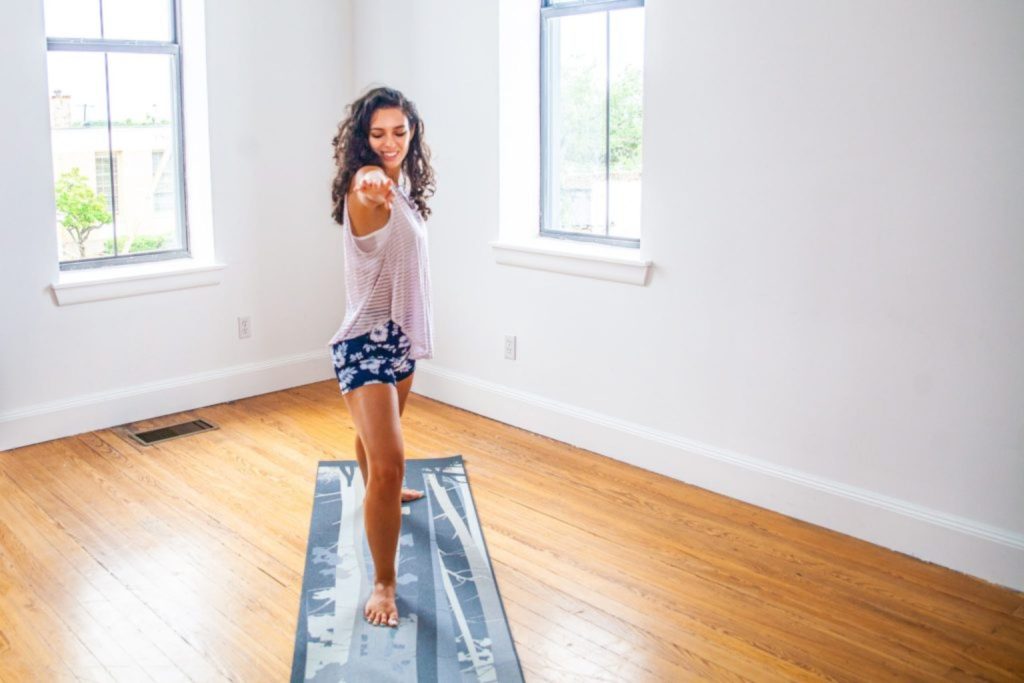 a woman standing on a mat