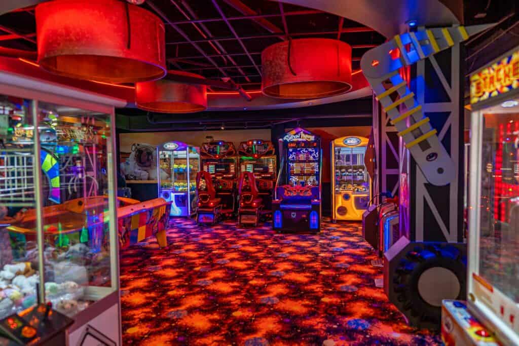 a room with arcade machines and lights