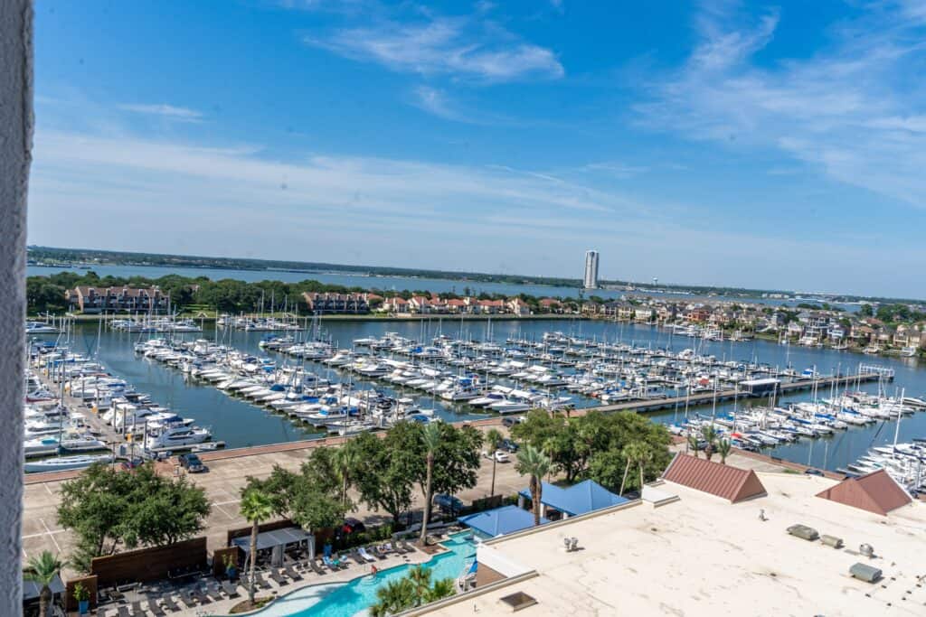 a marina with persony boats and a body of water