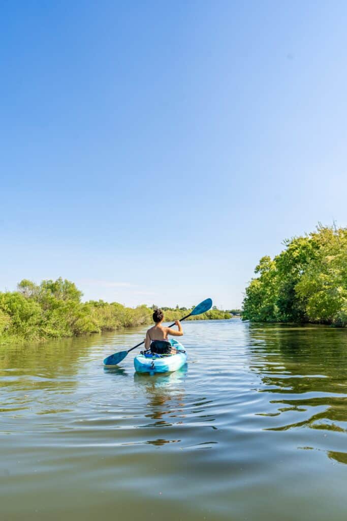 a person in a kayak on a river