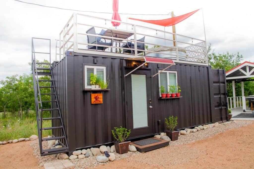 a container house with a balcony