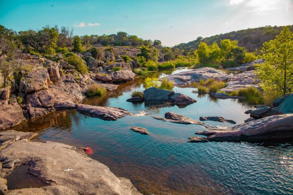 a river with rocks and trees