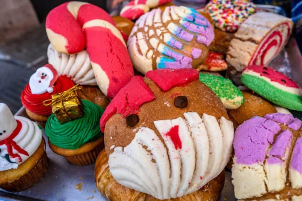 Christmas conchas that look like Santa and a candy cane