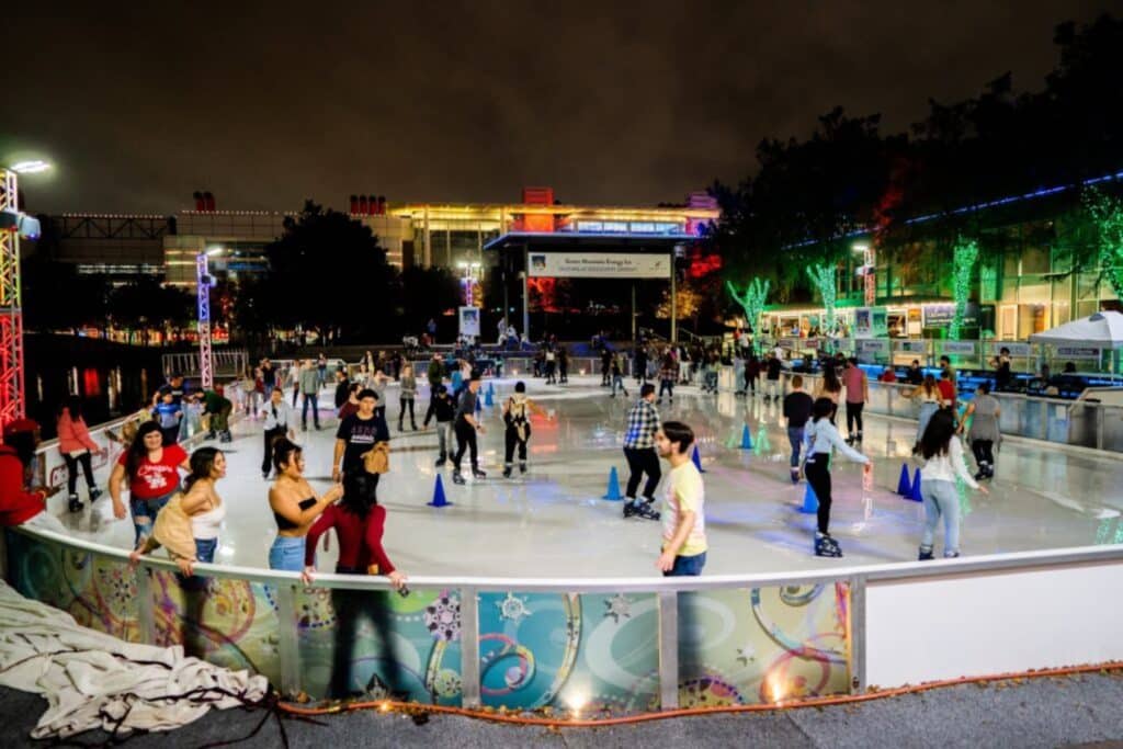 People skating on an outdoor ice rink