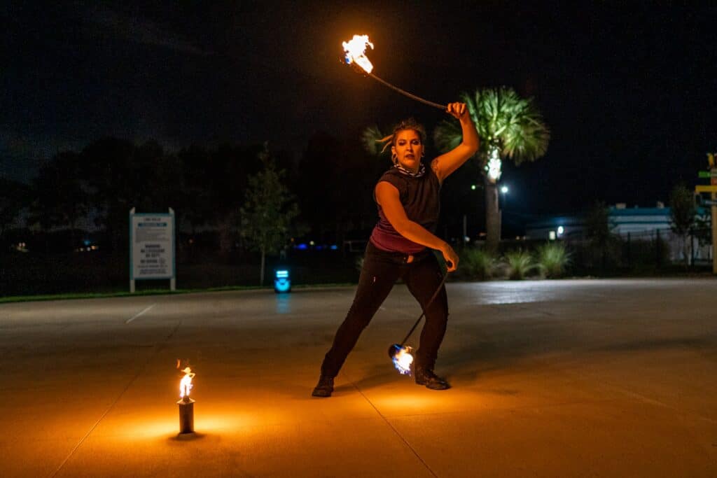 woman dancing with  fire