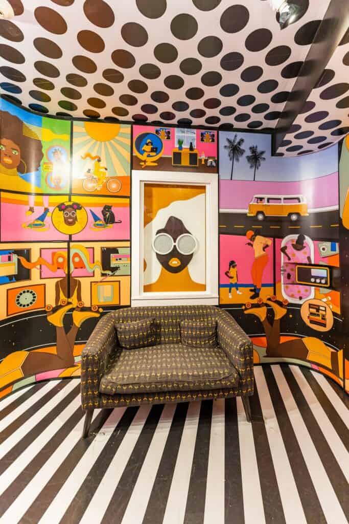 Art-filled room with a couch at Meow Wolf Date Night Ideas Santa Fe Couples