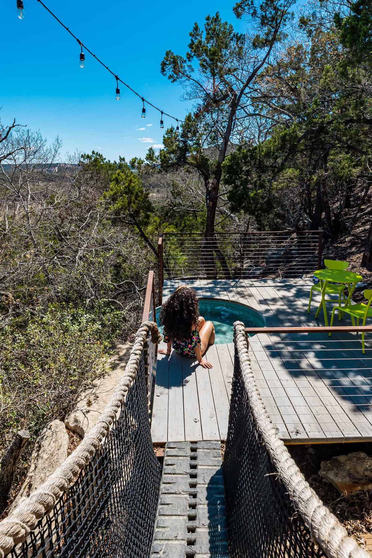 Woman Sitting nearby Dip Pool with over looking view