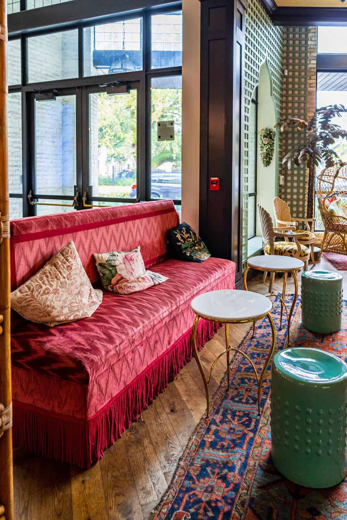 Red couch in Oxford Exchange atrium in Tampa things to do couples