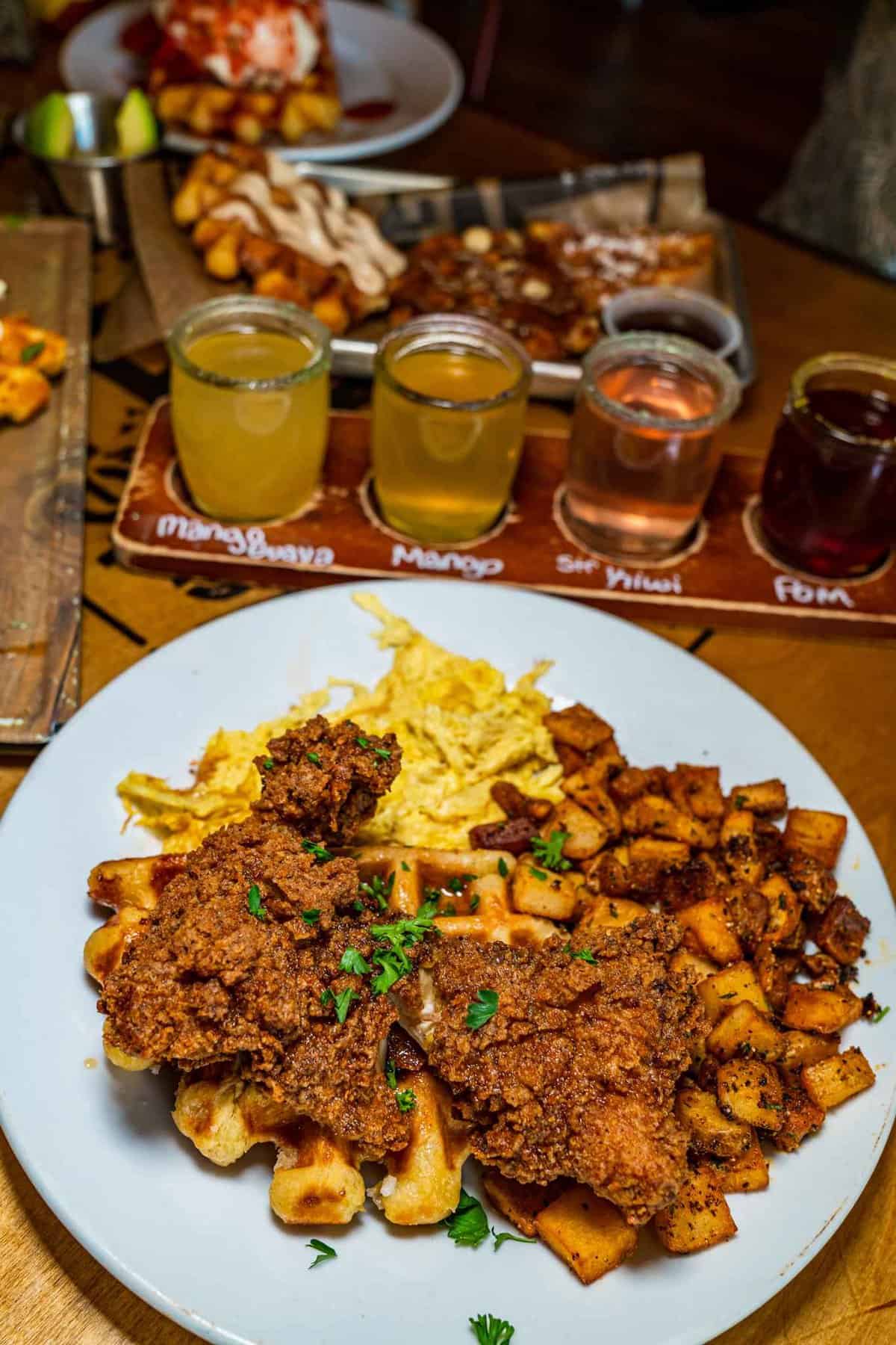 Meat sauce over waffle and a flight of beers at Water Street Waffle Co in Belton TX Things to do