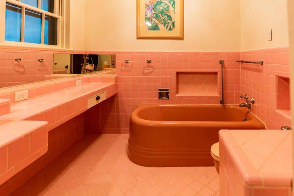 Pink tile bathroom with bathtub at Hotel RITUAL Where to Stay Jacksonville