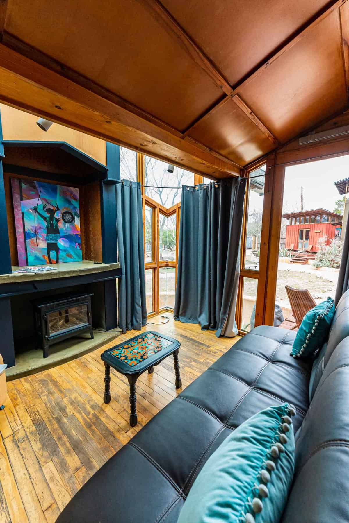 Living area inside of funky blue eco-cabin