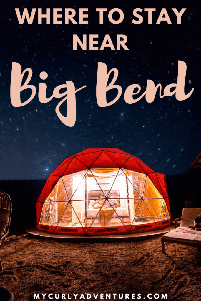 Stars in the night sky behind the glamping bubble with a couple sitting on the bed inside