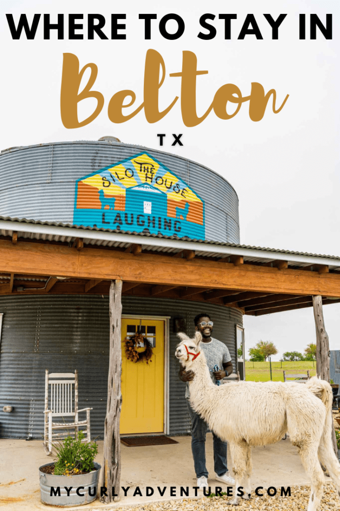 Man Posing outside the Silo Accommodation with a Llama