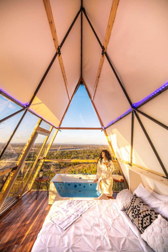 King size Bed and a glass-sided tub